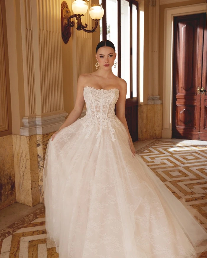 Romantic lace low-back wedding dress with train